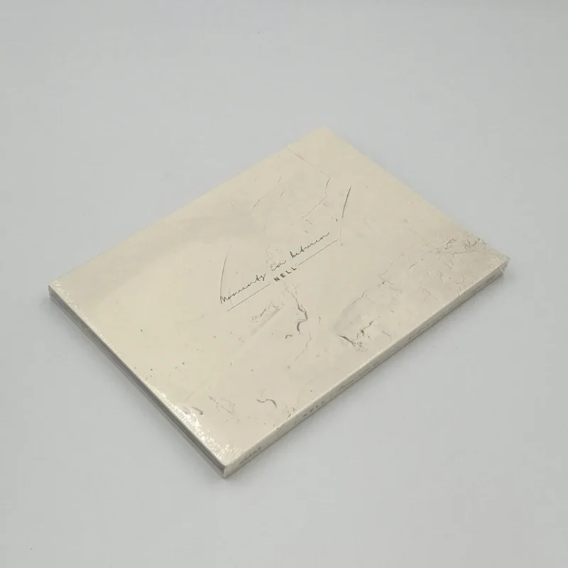 NELL - 9th Album Moments in between front